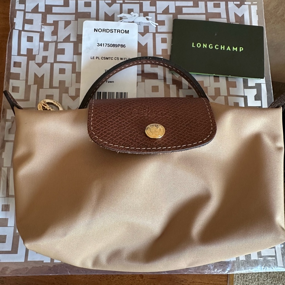 Longchamp Cream Bag with Durable Fabric and Brown Leather Trim